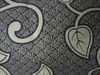 Flame retardant printed mattress fabric stitch bonded nonwoven