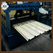 Roof panel roll forming machine