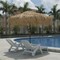 Vred Products: Seller of: palm leaf thatched umbrellas, palm leaf thatch cover, outdoor umbrella base, wire basket, hammock, peg hook, tiki umbrella, real grass mat.